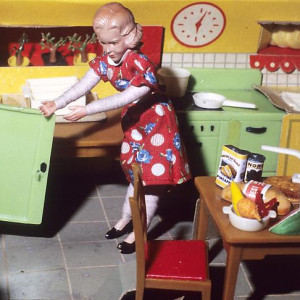 Woman Opening Refrigerator/ Milk to the Right